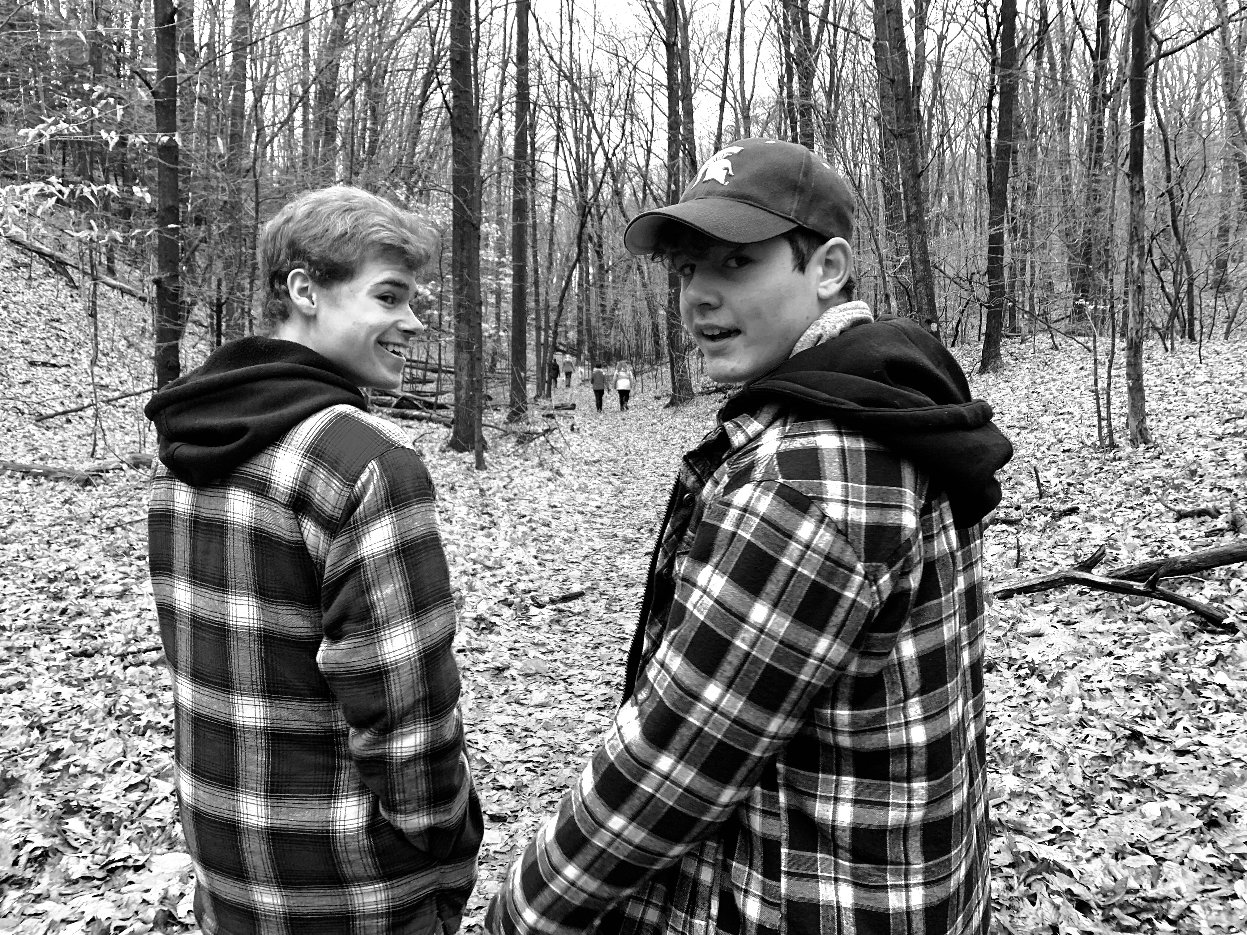 Logan and Anson Verlinde hiking in their matching flannels.