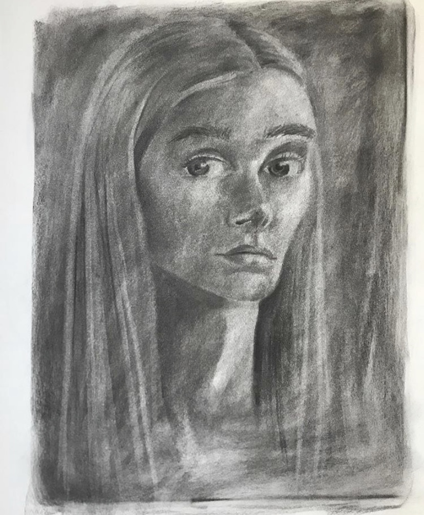 This is a self portrait made with charcoal.
